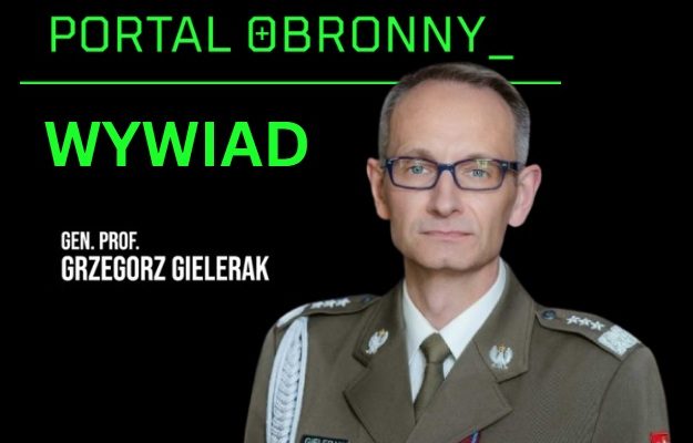 Na pierwszym planie Grzegorz Gielerak, w tle napis 